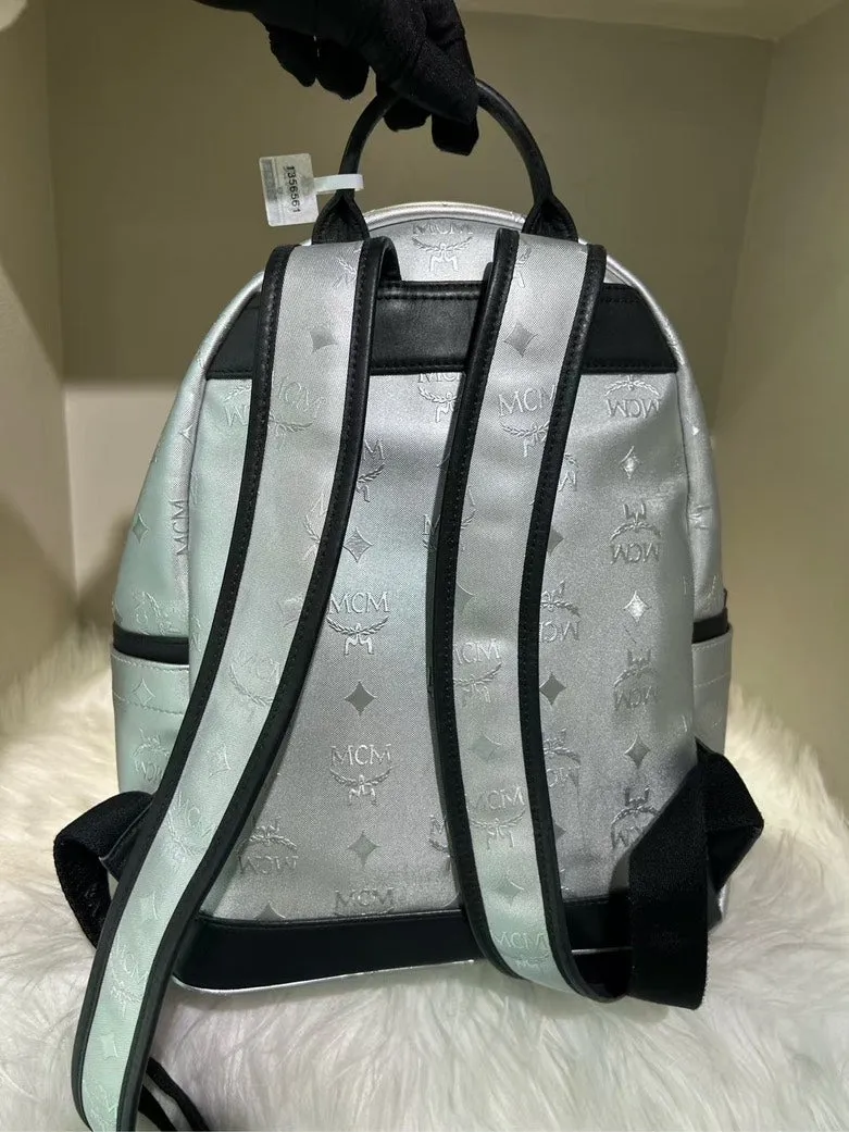 Pre-Loved MCM Stark Silver Backpack with Signature Logo Pattern and Black Accents